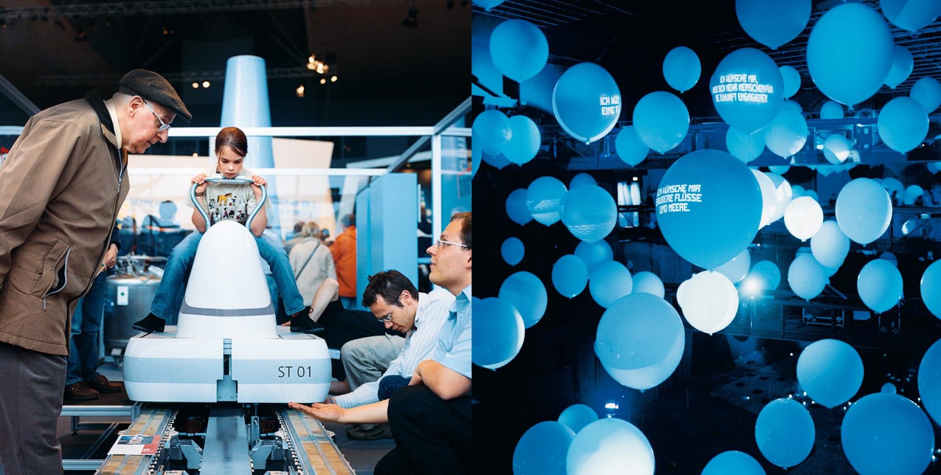 Mädchen sitzt im Ideenpark Thyssenkrupp auf technischem Gerät, daneben blaue Luftballons mit Schriftaufzug