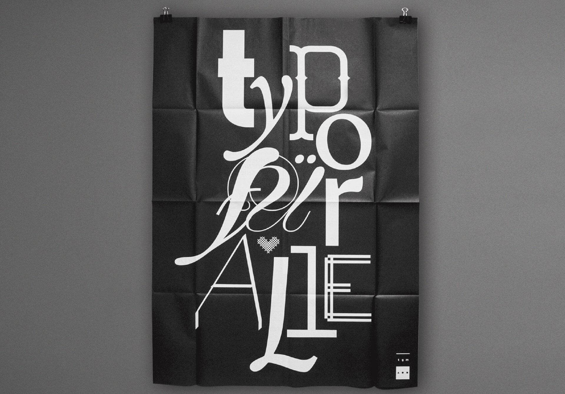 Plakat mit der weißen Typografie Typo für alle auf schwarzem Hintergrund für die Typografische Gesellschaft München